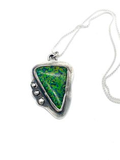 This pendant was set with a Gilson Opal with an organic look.  The pendant is 1.8 inches in height and 1.3 inches in width.  The chain is sterling silver and is extendable up to 23 inches in length.  Quite spectacular stone! Modern Pendant Necklace With Large Stone, Modern Sterling Silver Jewelry With Large Stone, Green Sterling Silver Fusion Necklace, Fusion Style Sterling Silver Necklace With Large Pendant, Sterling Silver Fusion Necklace With Large Pendant, Nature-inspired Sterling Silver Jewelry With Large Stone, Sterling Silver Necklace With Large Green Stone, Unique Sterling Silver Necklace With Large Stone, Artisan Sterling Silver Necklace With Large Stone