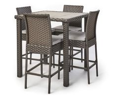 an outdoor table with four chairs and a bar stool in brown wicker, isolated against a white background