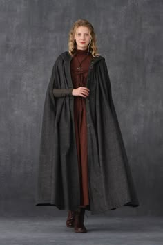 Medieval Winter Outerwear For Fantasy Events, Medieval Outerwear For Fantasy Events In Winter, Hooded Outerwear For Fantasy Events In Winter, Gothic Cape For Larp In Fall, Witchy Outerwear For Fall Costume, Winter Fantasy Long Coat Outerwear, Gothic Hooded Winter Cape, Winter Long Coat For Fantasy Events, Elven Style Cape For Larp In Fall