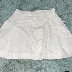 Free People Wrap Side Tie Fray Hem Pleated Mini Skirt. New Without Tags! 100% Cotton White Cotton Skort With Relaxed Fit, White Cotton Relaxed Skort, White Cotton Flowy Skort, Spring White Relaxed Fit Tennis Skirt, Spring Relaxed White Tennis Skirt, White Relaxed Skort For Day Out, White Cotton Skirted Skort, White Cotton Tennis Skirt For Day Out, White Tennis Skirt For Spring Day Out