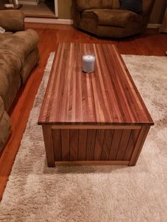 a wooden coffee table sitting on top of a white rug