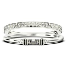 a white gold ring with diamonds on the sides and a baguettte cut diamond in the middle