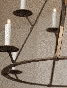 a chandelier with five candles in it