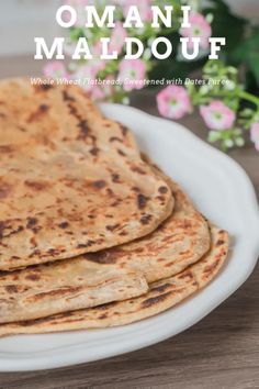 three flatbreads on a white plate with pink flowers in the background and text overlay