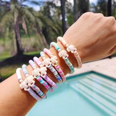 🛒The Preppy Turtle Bracelet is perfect for summer! This eye-catching accessory features colorful Heishi clay beads and stone turtle bead to create an ocean-inspired look. It's perfect for stacking or gifting to someone special. With its unique design and mix of colors, this stretch bracelet is sure to stand out! 📦FREE SHIPPING on orders $35 or more to US shoppers 💎Care = We recommend: -Remove when sleeping -Allow perfumes and lotions to dry before wearing -Roll the bracelet gently on and off your hand instead of overly-stretching the bracelet -Keep away from moisture (although polymer clay itself is water resistant, to extend the life of your jewelry you should avoid wearing in the shower or bath, pool, ocean, or lake, or around water-based chemicals) 🧵Material = 6mm Polymer Clay Heish Pink Heishi Beads Friendship Bracelets For Vacation, Pink Heishi Beads Bracelets For Vacation, Pink Heishi Beads Vacation Bracelets, Multicolor Friendship Bracelets With Round Beads For Beach Season, Multicolor Round Beads Friendship Bracelets For Beach Season, Multicolor Round Bead Friendship Bracelets For Beach Season, White Heishi Beads Friendship Bracelets For Vacation, Colorful Letter Beads Bracelet For Vacation, Playful Heishi Beads Bracelets For Beach