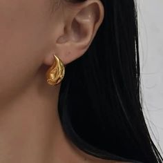 Elevate your style with these exquisite drop earrings featuring captivating texture. Crafted with precision, these earrings blend modern elegance with tactile allure. Lustrous Gold Plated on Stainless Steel. Hypoallergenic and great for most skin type. Post back closure. Dimensions: Earrings stands at about 0.8 inch and weigh 0.2 oz. Social Cause, Earring Stand, Women Leaders, Skin Type, Modern Elegance, Skin Types, Elevate Your Style, Your Style, Drop Earrings