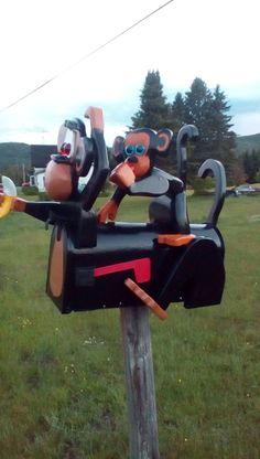 a mailbox decorated to look like cartoon characters