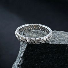 Oxidized 925 Silver Three Line Pave Diamond Eternity Band Handmade Ring Jewelry RIMJ-840 Pave Diamond Band Ring. Silver Diamond Ring. Eternity Band Ring. Oxidized 925 Silver Ring. Stack Ring. Handmade Fashion Jewelry. Here Are Some Amazing Ways To Take Care Of Your Precious Diamond Jewelry. Always. * Apply lotion, cosmetics, hairspray, and perfume before dressing in jewelry. * When undressing, wipe each piece with a clean soft cloth to remove oils and perspiration. * Store in a fabric-lined box, Silver Cubic Zirconia Stackable Rings With Halo, Silver Diamond-cut Stackable Rings, Silver Diamond Cut Stackable Rings, Silver Stackable Rings With Diamond Cut, Adjustable Silver Stackable Rings With Diamond Cut, Adjustable Stackable Silver Rings With Diamond Cut, Silver Pave Setting Eternity Band, Dazzling Silver Eternity Band For Promise, Silver Eternity Band With Pave Setting