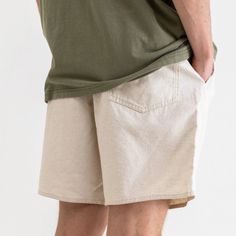 Rhythm: Classic Linen Jam Shorts - Sand The Linen Jam is your uncomplicated seasonal short for comfort and style crafted in breathable linen cotton blend. This short features an elastic tie up waist and woven logo detail on the hem in durable mid-weight fabric designed for everyday wear. DETAILS: 55% Linen 45% Cotton Elastic waist Lightweight linen blend fabric An everyday basic for easy wear Casual Linen Shorts For Spring, Relaxed Cotton Shorts For Beach Season, Relaxed Linen Shorts For Summer, Cotton Bottoms With Elastic Waistband For Warm Weather, Casual Cotton Shorts With Elastic Waistband, Solid Color Summer Shorts With Relaxed Fit, Relaxed Beige Shorts For Spring, Casual Cotton Shorts For Vacation, Relaxed Fit Shorts With Elastic Waistband For Beach Season