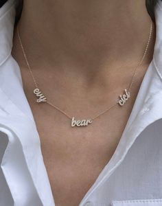 Personalize this multi name necklace with up to 6 names! All names are set with diamond stones! Available in 14K Yellow, White or Rose Gold All lowercase font only Letter size ranges from 4mm - 7mm depending on the letter Each one comes with a 1" extender FINAL SALE If you choose diamonds they will be spaced evenly like the names. 2 names: 1 or 3 diamonds - if 1 it will be in between the name, if 3 it will be on every side of the names 3 names: 2 or 4 diamonds - if 2 it will be in between the na Name Necklace Length Chart, Diamond Name Necklace, Necklace With Kids Names, Female Names, All Names, Gold Name Necklace, Name Jewelry, Jewelry Lookbook, Mom Necklace