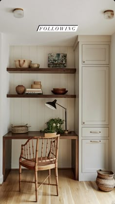 a wooden chair sitting in front of a shelf filled with books and other items on top of it