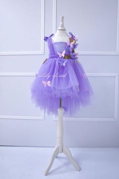 This is a beautiful and whimsical lavender baby dress that features 3D gold butterflies and a tulle princess skirt. It's the perfect outfit for a special occasion, such as a first birthday party or a wedding, and will make your little girl feel like a mini bridesmaid. The dress is handmade with care and attention to detail, ensuring a high-quality product that will last. With its soft and comfortable materials, your little girl will be able to dance and play all day in this beautiful dress. Whet Lavender Flower Dress, Baby Purple Dress, Flower Girl Wedding Dress, Girl Wedding Dress, Light Purple Dress, Baby Purple, Wedding Dress Tulle, Flower Girl Wedding, Tulle Top