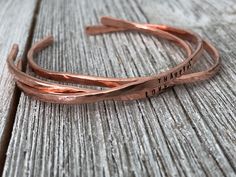 This listing is for one cuff Are you looking for a simple but elegant bracelet for someone you love? Personalize this bracelet with a word or two, and decide where on the bracelet you would like it stamped. :) This cuff is cut from bare copper wire, shaped and hammered all by me! :) Copper will develop a beautiful patina over time, but you can always brighten it back up with a polishing cloth if you like. Each bracelet is unique and will never be the same as another. These cuffs are meant to mor Engraved Copper Bracelet, Stamped Copper Cuff Bracelet As Gift, Stamped Copper Cuff Bracelet For Gift, Adjustable Rose Gold Cuff Bracelet For Anniversary, Copper Bracelets Handmade, Crystal Wrapping, Copper Jewelry Diy, Gold Coin Jewelry, Handmade Copper Bracelet