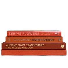 three books stacked on top of each other in front of a white background with the title seeing flowers