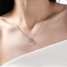 An eye-catching round moissanite dances with ease at the center of this appealing women's necklace, expressing your unstoppable love. Additional round gem set in sterling silver frame the center. Features Moissanite was originally found in meteorites(Chemical name: Silicon Carbide). It was first discovered in 1893, while a scientist was examining meteor samples from a crater in Arizona. After many years, the experts has been recreated moissanite in the laboratory, that make the gemstone with fri Elegant Silver Solitaire Necklace With Lab Grown Diamond, Elegant Silver Solitaire Necklace With Lab-grown Diamond, Elegant Silver Solitaire Necklace, Dazzling Lab Grown Diamond Necklaces, Elegant Silver Necklace With Lab Grown Diamond, Square Solitaire Cubic Zirconia Necklace With Diamond Cut, Cubic Zirconia Solitaire Necklace With Square Pendant, Cubic Zirconia Square Pendant Solitaire Necklace, Cubic Zirconia Necklace With Center Stone For Gift