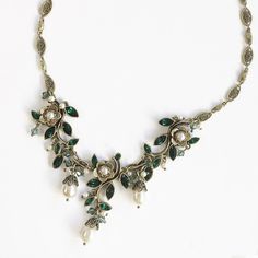 "This winding vine creates a neo-romantic look infused with the essence of mid-century American style. Its graceful links are set with premium emerald green marquis cut crystal. Pearl beads and drops dangle below Hand burnished bronze. Length: 17\" plus 4\" extender. Made at Sweet Romance in our Los Angeles studio. Free shipping." Emerald Statement Necklace, Neo Romantic, Emerald Green Crystal, Necklace Emerald, Fairy Jewelry, Turquoise Accents, Sweet Romance, Green Jewelry, Green Crystal