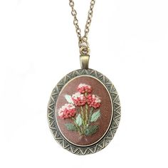 a necklace with pink flowers on it