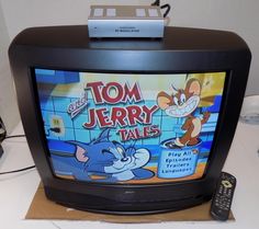 an old television with tom jerry tales on it