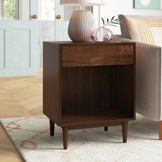 a living room scene with focus on the end table and lamp in the foreground