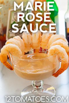 there is a glass bowl with some food in it and the words marie rose sauce above it