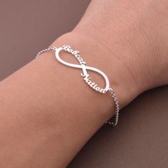 This Personalized Infinity Name Bracelet is one of the most special and personal pieces of jewelry you can own or give as a gift. This Infinity Name Bracelet is made of solid sterling silver. All items are nicely packaged ready to gift in elegant jewelry boxes. Product Description Pendant&Chain:Sterling Silver Color: silver, gold,rose gold,white gold Nameplate Width: 20-30 mm (according to the length of the names,its size is not fixed) Thickness : 1.2 mm. (approx.) ###How to order### Please choo Silver Bracelets For Birthday And Valentine's Day, Sterling Silver Bracelets For Birthday And Mother's Day, Silver Bracelets For Birthday Gift On Mother's Day, Silver Bracelets For Mother's Day Birthday Gift, Mother's Day Infinity Bracelet Gift, Silver Adjustable Name Bracelet For Birthday, Adjustable Silver Name Bracelet For Birthday, Silver Minimalist Name Bracelet As Gift, Personalized Silver Bracelets As Birthday Gift