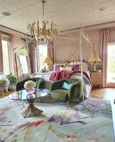 a living room filled with furniture and a chandelier