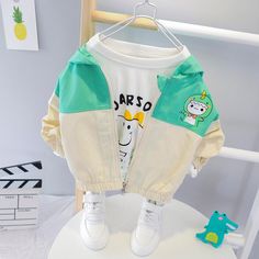 Girls Cute Hooded Long Sleeve Zipper Jackets - PrettyKid Playful White Long Sleeve Outerwear, White Stretch Hooded Outerwear, Playful Long Sleeve Outerwear For Outdoor, Green Hooded Windbreaker With Zipper, Green Hooded Windbreaker With Zipper Closure, Playful Cotton Outerwear For Outdoor, Green Stretch Hooded Outerwear, Playful Hooded Winter Windbreaker, Playful Hooded Windbreaker For Winter