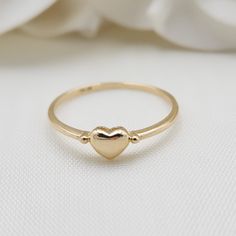 Beautiful stackable solid 14k gold mini polished yellow gold heart ring. Perfect to wear everyday, everywhere. Adorable, modern and everlasting. 14k Gold will not tarnish or rust. Perfect gift ! Materials: 14k Solid Yellow Gold Sizes: 5 to 10 Us Weight: 1.1 grams (approx) 14k stamped Brand new Fast shipping Elegant gift box included  Briza Collections is a small family owned business that works hard on providing the best selection of Fine Solid 14k Gold Jewelry for the best prices.  Our main goa 14k Gold Stackable Rings With Heart Charm For Anniversary, Dainty Stackable Yellow Gold Heart Ring, 14k Gold Stackable Rings With Heart Charm, Dainty Yellow Gold Stackable Heart Ring, Elegant Everyday Ring With Heart Charm, Elegant Everyday Heart Ring With Charm, Elegant Heart Cut Rings For Everyday, Dainty 14k White Gold Heart Ring, Elegant Everyday Heart Cut Ring