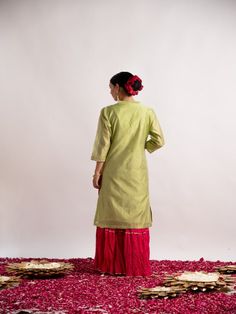 Pista green silk chanderi straight kurta detailed with beautiful gotta pati hand work, has a mandarin collar, three-quarter sleeves, Rani cotton wrinkled sharara with gotta line. This kurta sharara comes with wrinkled rani dupatta with tassels. Fabric: Chanderi Silk & Wrinkled Cotton Color: Pistachio green and hot pink Note: Wash Care Instruction - Dry Clean Only The product will be shipped within 15-20 days of order placed Size Chart: Kurta Size XS S M L XL XXL XXXL Bust 36 38 40 42 44 46 Waist