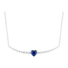 Appearing to float along a strand of diamonds, a vivid blue, heart-shaped sapphire makes an impactful impression in Ri Noor’s Floating Ruby Heart and Diamond Necklace. Round diamonds increase in size towards the central element of the necklace, creating a design that is subtle yet elegant, dazzling yet approachable. The slightly curved horizontal bar is suspended on a simple chain, all set in 18k white gold. Blue Sapphire Heart Pendant Necklace, Blue Sapphire Heart Pendant Necklaces, Elegant Jewelry With Lab-created Sapphire For Valentine's Day, Elegant Lab-created Sapphire Jewelry For Valentine's Day, Formal Sapphire Heart Necklace, Heart-shaped Sapphire Necklace For Formal, Heart-shaped Sapphire Necklace For Formal Occasions, Sapphire Heart Pendant Necklaces For Valentine's Day, Sapphire Heart Pendant Necklace For Valentine's Day