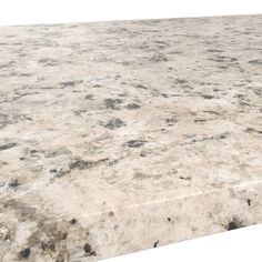 a large white marble table top with black dots on the edges and gray spots on the surface