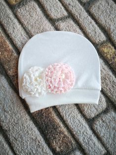 This item is available in primary color: pink, secondary color: beige. We designed and made beanie baby hats from newborn soft cotton fabric for new mom and babies maybe baby shower gift.    #babyheadband #babybeanie #newbornbabybeanie #infantbeanie  #newbornbabyhat #babyshowergift #babytiara #babygirlwrap #newmomgift  #newmomtiara #birthgiftformom #babyshowergift #newbabygift White Handmade Hats For Birthday, Adjustable Soft Hat For Gifts, Adjustable Soft Hat As A Gift, Soft Adjustable Hat As A Gift, Adjustable Soft White Beanie, Cute White Baptism Hat, Adjustable Soft White Bonnet, White Adjustable Beanie For Babies, Soft Adjustable White Bonnet