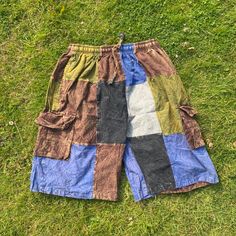 Summer Cargo Shorts | Cotton | Patched | Hippie | Beach | Comfy | Eco Friendly  - Stone washed cotton shorts.  - light and comfy with natural dye colour  - Handmade item  - Perfect wear for summer  - Two side pockets plus one at the back - 100% Organic Cotton - Made in Nepal  Because it's handmade and made by stitching different patches together , the one you will receive might not be 100% identical to the picture . The patch placements might be different and also the symbols   Item no. 1101 Fre Casual Cotton Patchwork Shorts, Casual Festival Shorts, Green Festival Bottoms With Built-in Shorts, Festival Green Bottoms With Built-in Shorts, Hippie Summer Festival Shorts, Multicolor Cotton Jean Shorts With Pockets, Hippie Festival Bottoms With Built-in Shorts, Summer Patchwork Jean Shorts, Patchwork Jean Shorts For Summer