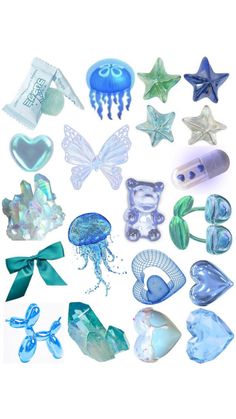 various sea glass items are arranged on a white surface, including starfishs and jellyfish