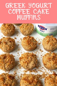 some muffins are sitting on a white tray with the words greek yogurt coffee cake muffins