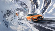 an orange car driving through a tunnel in the snow