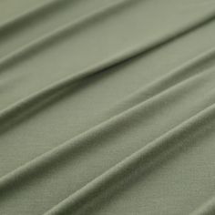 a close up view of a plain green fabric