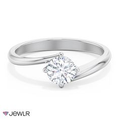 a white gold engagement ring with a single diamond