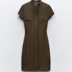 New With Tag Zara S/S 2024 Collection Round Neck Mini Dress With Short Sleeves. False Welt Pockets At Chest. Interior Lining. Front Zipper Closure Hidden By A Flap. Dark Khaki 2245/717 Outer Shell 92% Polyester 8% Elastane Lining 100% Polyester Which Has At Least: Lining 100% Rcs-Certified Recycled Polyester Outer Shell 92% Rcs-Certified Recycled Polyester Clothing Care Guide Hand Wash Max 30c/86f Do Not Use Bleach / Whitener Iron Maximum 110c/2309f Do Not Dry Clean Do Not Tumble Dry Casual Fitted Dress With Stand Collar, Fitted Midi Dress With Stand Collar For Work, Zara Short Sleeve Dresses For Work, Zara Short Sleeve Work Dresses, Zara Short Sleeve Workwear Dresses, Fitted Stand Collar Dress For Workwear, Zara Stretch Midi Dress For Work, Brown Mini Length Office Dress, Chic Fitted Dress With Stand Collar