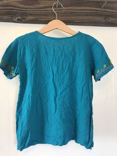 This top is in great condition and it's super soft cotton with stunning floral embroidery. It's best fitted for a 4-6 year old with measurements provided in the photos for an accurate fit. It's the perfect little hippie top to tuck into ol' Levis or bloomers ✌🏽 (5) Bohemian Cotton Summer Shirt, Bohemian Cotton Shirt For Summer, Spring Bohemian Crew Neck Blouse, Casual Short Sleeve Top With Boho Collar, Spring Boho Collar Short Sleeve Tops, Casual Boho Collar Short Sleeve Top, Summer Cotton Embroidered Crew Neck Top, Summer Tops With Multicolor Embroidery And Crew Neck, Embroidered Cotton Shirt For Vacation