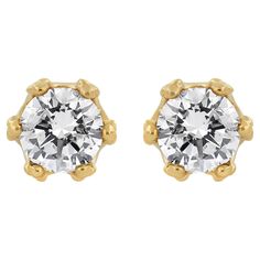 With regal hidden details, these diamond stud earrings are anything but ordinary. From the front, these 14kt yellow gold studs look like solitaires with a multi-prong setting. But the sideview brings into focus the crown design. Round diamond accents stud the base of the crown and the points hold the front-facing round diamond in place. These earrings include 2.0 cttw of natural diamonds and they have posts with screw backs for comfortable secure wear. These elegant gold and diamond crown studs Classic Gold Diamond Earrings With Brilliant Cut, Gold Diamond Earrings With Vvs Clarity For Formal Events, Gold Diamond Earrings Stamped 14k For Anniversary, Classic 14k Stamped Diamond Earrings, Classic 14k Diamond Earrings, Classic 14k Diamond Earrings For Anniversary, Classic Diamond Earrings Stamped 14k, Yellow Gold Diamond Earrings Stamped 14k For Formal Occasions, 14k Stamped Yellow Gold Diamond Earrings For Formal Occasions