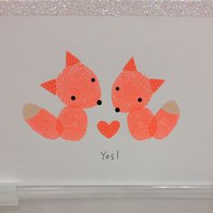 an image of two foxes with hearts on their backs and the words yes written in black