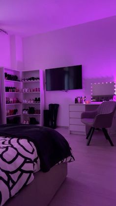 a bedroom is lit up with purple lighting and shelving units in the corner, along with a large bed