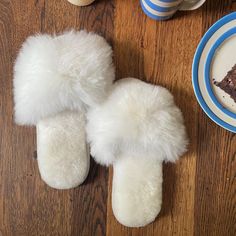 Delight yourself or someone else with these gorgeous alpaca fur slippers that feel like fluffy little clouds on your feet. These slippers are perfect for traveling, as they're lightweight, pack flat and come with a Fluff Alpaca muslin bag. Despite their light weight, they envelope your feet in a deep cushion of alpaca fur, merino lambskin and suede for added natural softness and durability. Ideal for both transitional weather and through the winter months. Designed in Scotland by Samantha Holmes Comfortable Fluffy White Slippers, White Fluffy Indoor Slippers, Fluffy White Indoor Slippers, White Fluffy Slippers With Round Toe, Fluffy White Slip-on Slippers, Cozy White Closed Toe Slippers, Alpaca Clothing, Alpaca Gifts, Pet Brush