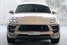 the front end of a white porsche cayen