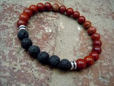 This wrist mala is a combination of black lava stone and brick-red jasper with silver accent beads. A meaningful wrist mala that is perfect for men and Energy Yoga, Wrist Mala, Bracelet Wrist, Diffuser Jewelry, Men Bracelet, Yoga Bracelet, Bracelet Men, Mala Bracelet