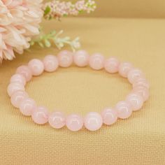 Wrap yourself in the gentle embrace of love and compassion with our Gemstone Rose Quartz Bracelet. Crafted from exquisite rose quartz beads, this bracelet serves as a reminder to open your heart, nurture your relationships, and cultivate inner peace and harmony. * High-Quality Beaded Bracelet* Unisex Bracelet* 8mm beads* Made to Fit Your Wrist or Anklet* Made with Pure Positive Energy* Great Gift for Everyone Pink Rose Quartz Bracelets For Meditation, Pink Beaded Bracelets For Meditation, Pink Rose Quartz Bracelet For Meditation, Elegant Rose Quartz Crystal Bracelet For Meditation, Rose Quartz Beaded Bracelet For Meditation, Rose Quartz Round Beads Bracelet For Valentine's Day, Pink Gemstone Beads Bracelets For Meditation, 8mm Rose Quartz Meditation Bracelets, Love And Compassion