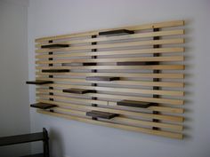 a wall sculpture made out of wooden planks