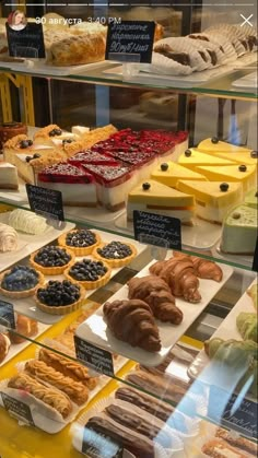 a display case filled with lots of different types of pastries