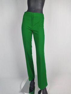 Fabulous 70s vintage flared pants/ bell-bottoms by Gaston Jaunet. Made from bright grass green wool. Featuring front zip closure, top stitch details. Unlined. Made in France. SIZE TAG: F40, in modern sizing more like F38. Please check measurements below. FABRIC CONTENT: 85% wool 15% polyamide CONDITION: excellent. MEASUREMENTS (taken flat, not doubled): Waist: 36 cm / 14 1/4" Hip: 48 cm / 19" Front rise: 26 cm / 10 1/4" Inseam: 82 cm / 32 1/2" Flare: 27 cm / 10 3/4" Please do not hesitate to contact me if you have any questions. Fitted Green Pants, Fitted Green Wide Leg Bottoms, Green Fitted Wide Leg Bottoms, Fitted Wide Leg Green Bottoms, Fitted Flare Bottoms In Green, Fitted High-waisted Green Pants, Green Fitted High-waisted Pants, Green Fitted Flare Bottoms, Fitted Flare Green Bottoms